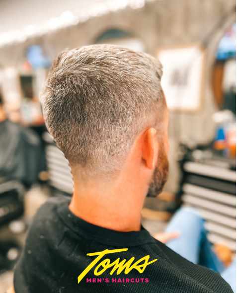 A man with a stylish low fade