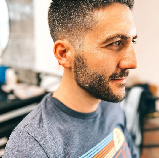 A man with a stylish beard. 