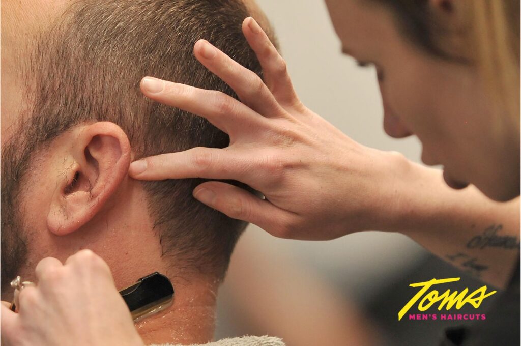 close-up of a client getting a neckline cleanup